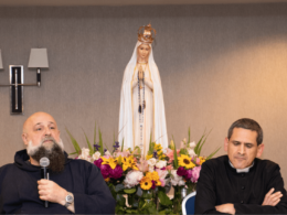Fr. Isaac and Fr. Rodriguez speaking at an Ask Father session with Our Lady of Fatima statue behing them